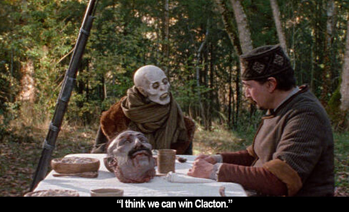 Vampire sitting at a picnic table with a severed head on it: "I think we can win Clacton."